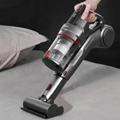 Dibea DW500 Pro cleaning a bed