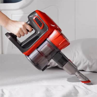 Vacuuming a bed